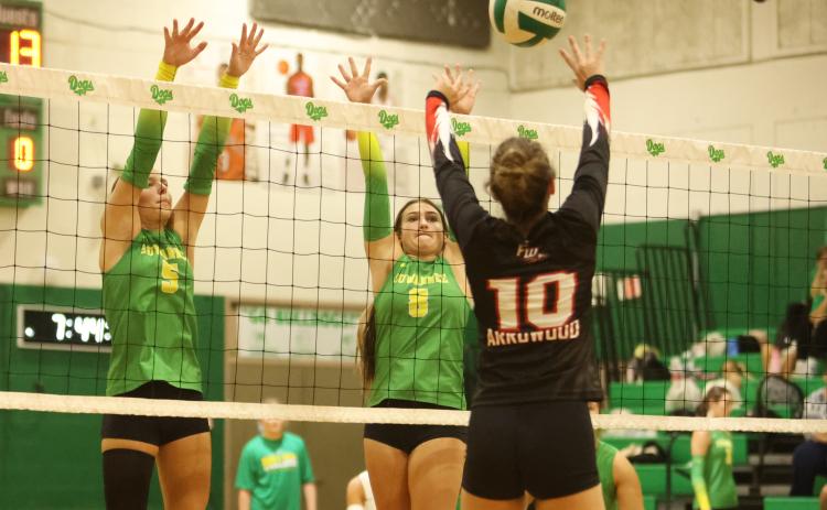 Suwannee hitters Kenlie Lindboe (5) and Jaci Thomas (8) defend a shot from Fort White hitter Arayna Arrowood on Tuesday night. (PAUL BUCHANAN/Lake City Reporter)