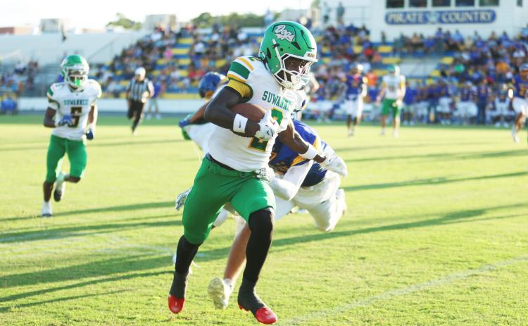 Suwannee receiver Ajari Williams heads to the end zone for a touchdown against Crystal River last Friday. (PAUL BUCHANAN/Lake City Reporter)