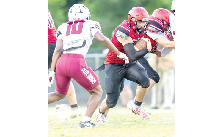 Lafayette running back Trevor Byrd powers ahead against Madison County in the teams’ spring game. (JACK HOWDESHELL/Lake City Reporter)