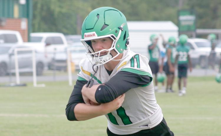 Suwannee quarterback Haigen Johnson runs through a drill during the first day of fall practice on July 27. (JAMIE WACHTER/Lake City Reporter)