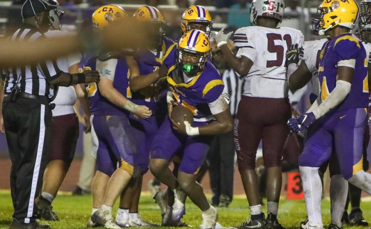 Columbia defensive end Mikel Morgan comes out of the pile after intercepting a pass against Madison County on Friday. (BRENT KUYKENDALL/Lake City Reporter)