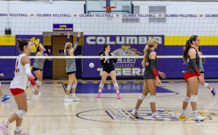 Lafayette delivers a deep serve out of bounds to give Columbia match point in a sweep Monday night. (JACK HOWDESHELL/Lake City Reporter)