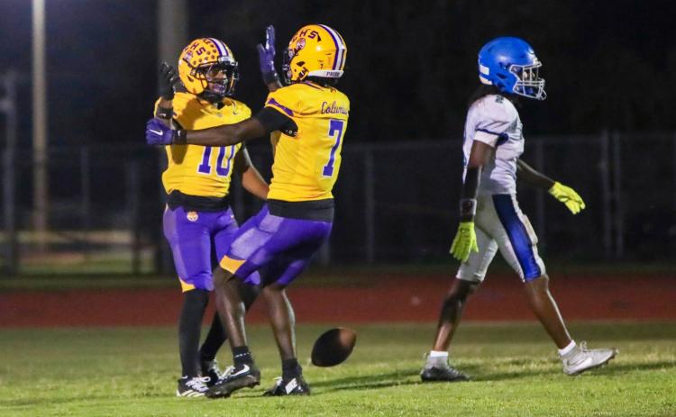 Columbia receiver Antonio Days (10) celebrates with receiver Kyren Caldwell (7) after one of his two touchdown receptions against Riverside on Friday. (BRENT KUYKENDALL/Lake City Reporter)