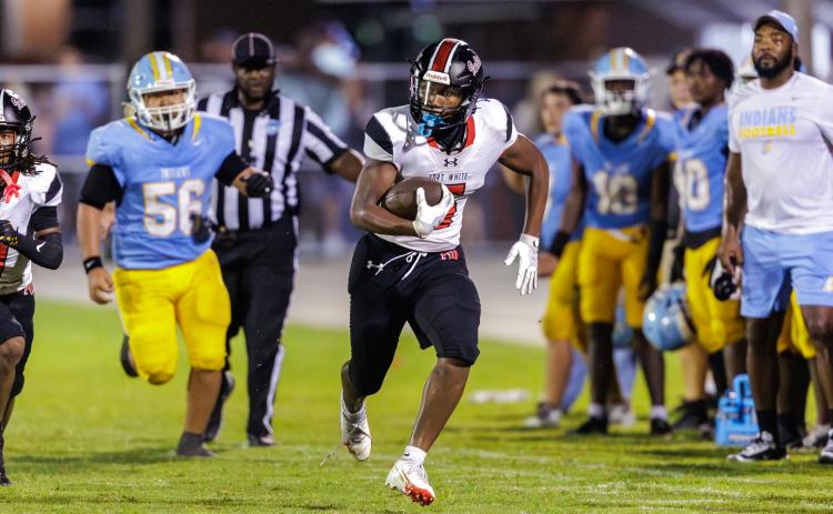 Fort White linebacker Brandon Robinson returns a fumble for a touchdown against Chiefland on Aug. 28. (JACK HOWDESHELL/Lake City Reporter)