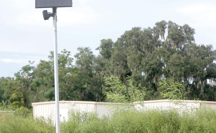 A Flock Safety camera sits along U.S. Highway 90 on the east side of Live Oak on Tuesday. (JAMIE WACHTER/Lake City Reporter)