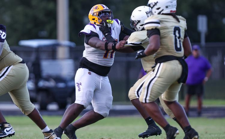 Defensive tackle Jaden McCray tries to fight off an Oakleaf block during Columbia's Kickoff Classic on August. 14. (GARY LLOYD MCCULLOUGH/Special to the Reporter)