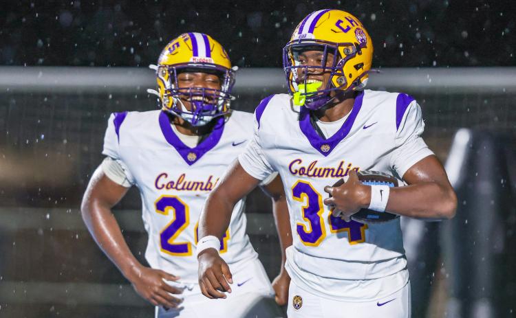Columbia defensive end Mikel Morgan (34) celebrates after scoring a touchdown off a blocked punt by defensive end Jae’quan Wilson during Friday’s 49-0 win over Ribault. (GARY LLOYD MCCULLOUGH/Special to the Reporter)