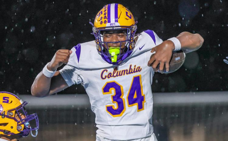Columbia defensive end Mikel Morgan celebrates after scoring on a blocked punt against Ribault on Friday. (GARY LLOYD MCCULLOUGH/Special to the Reporter)