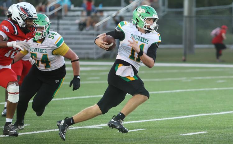 Suwannee quarterback Haigen Johnson scrambles upfield against Wakulla last Friday. (PAUL BUCHANAN/Lake City Reporter)