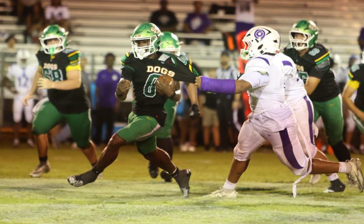 Suwannee running back Travon Fead tries to escape a tackle from a Gainesville defender last Friday. (PAUL BUCHANAN/Lake City Reporter)