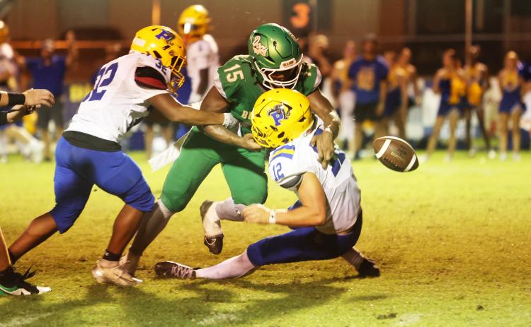 Suwannee linebacker Marco Rojas forces a fumble on a sack of Palatka quarterback Noah McKinley on Friday night. Rojas had 3.5 sacks in the game. (PAUL BUCHANAN/Lake City Reporter)