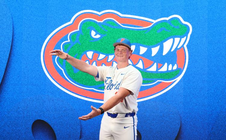 Columbia two-way standout does the Gator chomp on his recent visit to Florida. Slaymaker committed to UF on Saturday. (COURTESY)