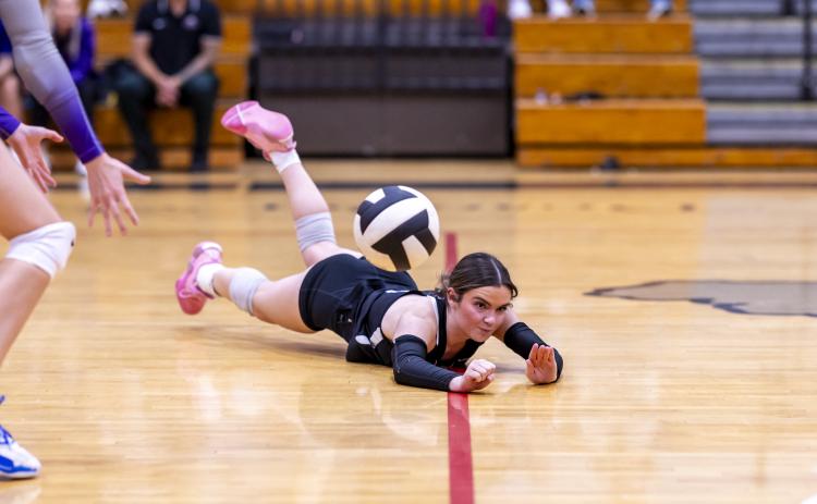 Columbia libero Kinslee Hall hits the floor hard as she dives for a dig against Lafayette on Sept. 3. (JACK HOWDESHELL/Lake City Reporter)