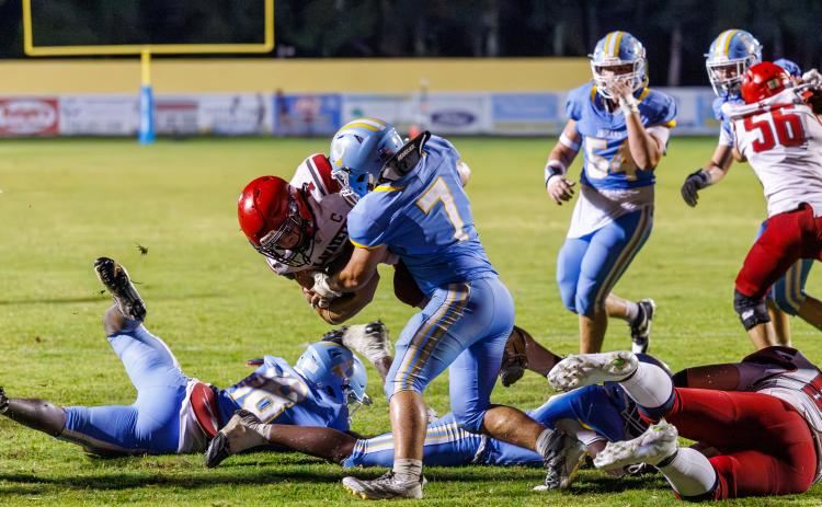 Chiefland linebacker Andrew Thisse stops Lafayette running back Trevor Byrd short of the goal line on the Hornet’s two-point conversion attempt in overtime. (JACK HOWDESHELL/Lake City Reporter)