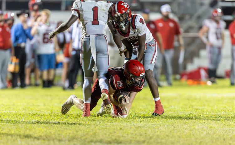 Lafayette defensive back Tucker Higginbotham seals the victory with an interception against Dixie County in the final minutes Friday. (JACK HOWDESHELL/Lake City Reporter)
