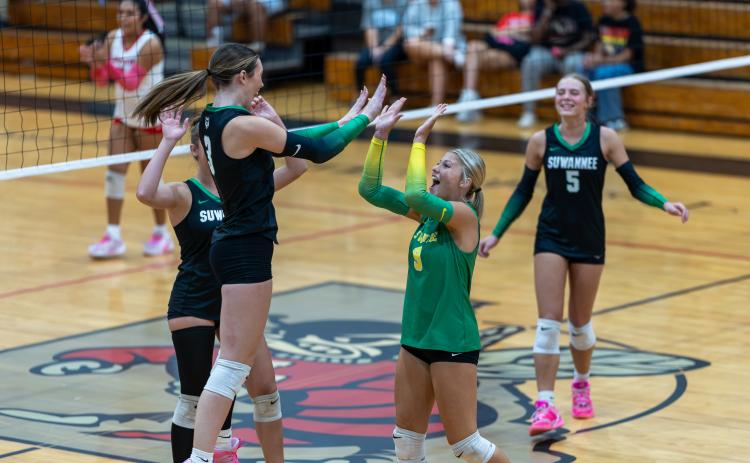 Suwannee hitter Jaylin Nash (3) celebrates one of her kills with libero Alivia Buda (6) and her teammates during Tuesday's win over Lafayette. (JACK HOWDESHELL/Lake City Reporter)
