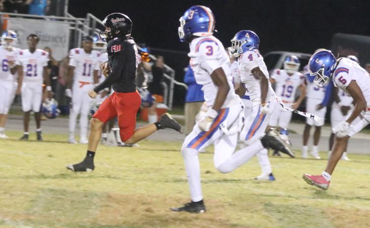 Fort White running back Ezekiel Powell sprints to the end zone for an 83-yard touchdown run and the winning score in Friday’s 27-20 win over Taylor County. (MORGAN MCMULLEN/Lake City Reporter)