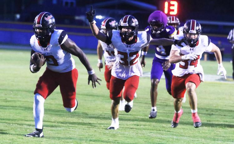 Fort White defensive tackle Josiah Harmon (9) returns a fumble for a touchdown as Bryce Bailey (32) celebrates during Friday’s win over Union County. (MORGAN MCMULLEN/Lake City Reporter)