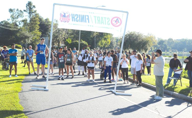Runners at the Pregnancy Care Center 5K Walk/Run for Life get set up near the starting line of Saturday’s event. Hundreds turned out for the fundraiser. (TONY BRITT/Lake City Reporter)