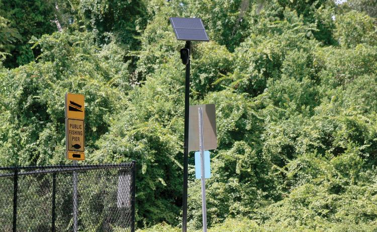 FILE A Flock Safety license plate reader camera sits along Baya Avenue by the entrance to the Lake Montgomery boat ramp. The state is shutting down the use of the cameras on state roads due to privacy concerns. (FILE)