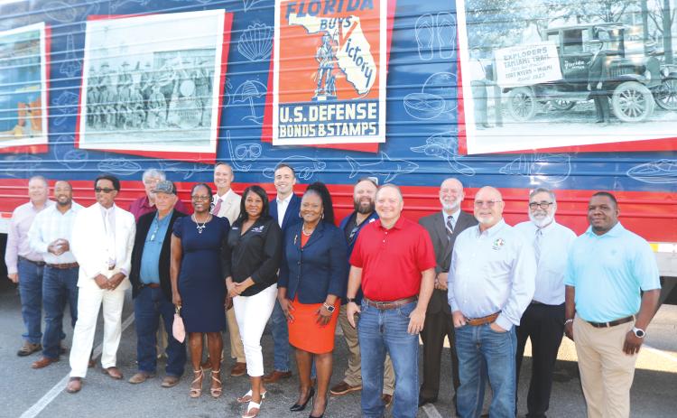 City of Lake City, Columbia County and state officials gather outside the Florida Freedom Tour truck ahead of their own look at the exhibit inside. (TONY BRITT/Lake City Reporter)