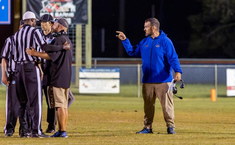 Branford coach Will Dettor (right) and his assistant challenge the referees on a call during a game against Crescent City on Sept. 25. (JACK HOWDESHELL/Lake City Reporter)