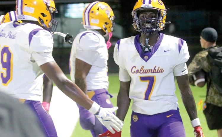 Columbia receiver Kyren Caldwell celebrates with teammates on the sideline after catching a touchdown pass against Manatee on Friday. (JORDAN KROEGER/Lake City Reporter)