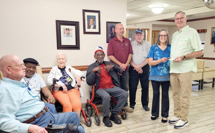 Veterans Robert (Air Force) (from left), Samuel (Navy), Janet DaSilva (Army and Elk member), Tuck (Air Force), John Strayer (ER), Donald Watson (past PDD), Lori Watson (Grant Coordinator) and Ed DaSilva (VA Domicilary Activities Director) were present for the Live Oak Elks Lodge’s donation toward Domiciliary field trips. (COURTESY LIVE OAK ELKS LODGE)