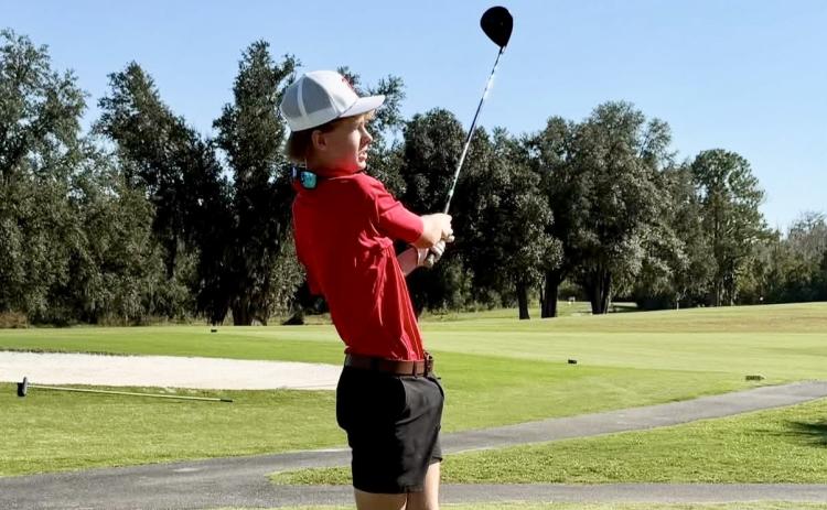 Lafayette golfer Cooper Kerby swings away during Thursday’s match against Madison County. (COURTESY)