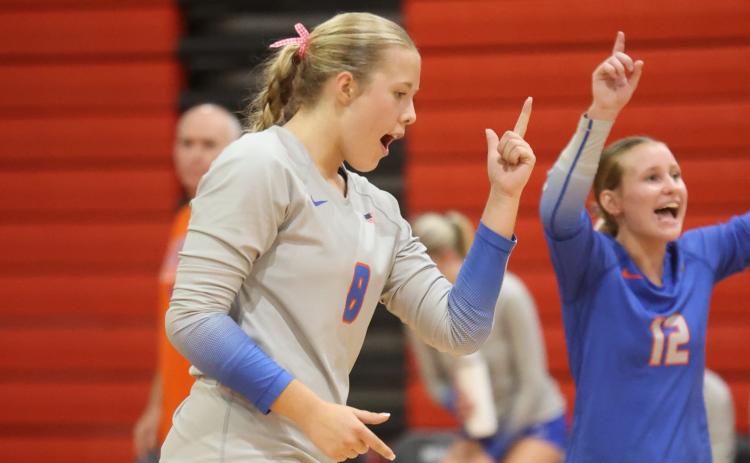Branford hitter Anabella Dicks (left) and libero Ava Alcorn (right) celebrate a point against Fort White on Sept. 22. (PAUL BUCHANAN/Lake City Reporter)