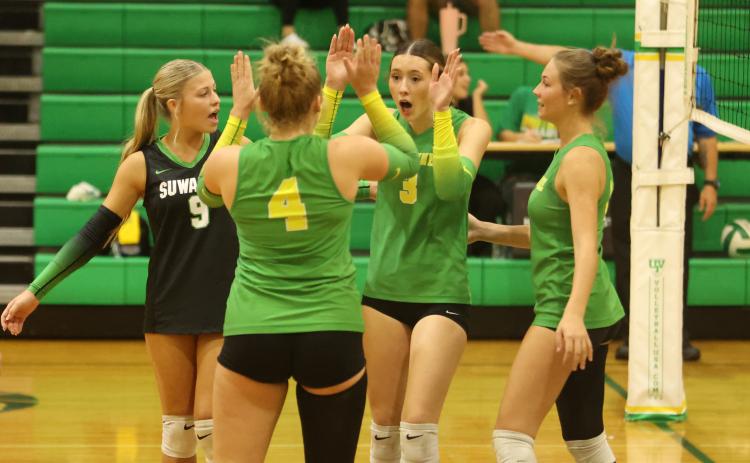 The Suwannee Bulldogs celebrate after a point against Columbia on Sept. 30. (PAUL BUCHANAN/Lake City Reporter)