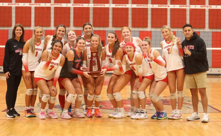 Lafayette poses with its District 5-R championship trophy after its 3-1 win over Aucilla Christian on Thursday. (MORGAN MCMULLEN/Lake City Reporter)