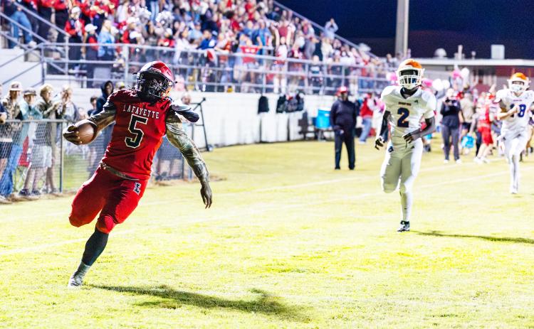 Lafayette running back Zamarion Hawkins scores a touchdown against Branford on the Hornets’ first possession Friday night. (JACK HOWDESHELL/Lake City Reporter)