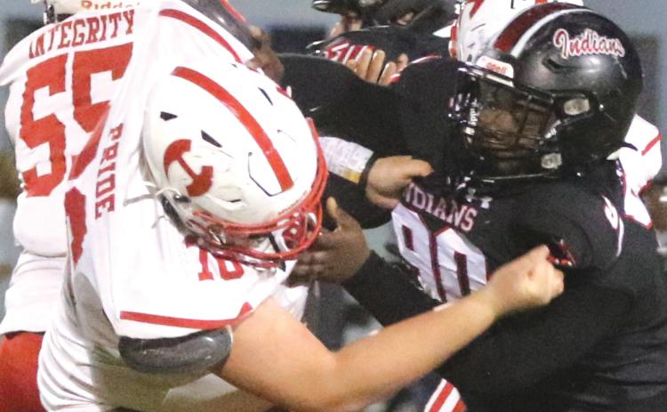Fort White defensive tackle Jaden McCray fights off Hamilton County center Cash Roberson as he blows up a run play last Friday. (MORGAN MCMULLEN/Lake City Reporter)