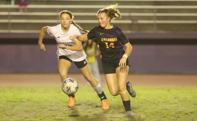 Columbia’s Leah Shields dribbles the ball up the field while Suwannee’s Abbigail Jewell gives chase. Shields, who was an all-area honoree last season, will help lead the Tigers attack again this season. (PAUL BUCHANAN/Lake City Reporter)
