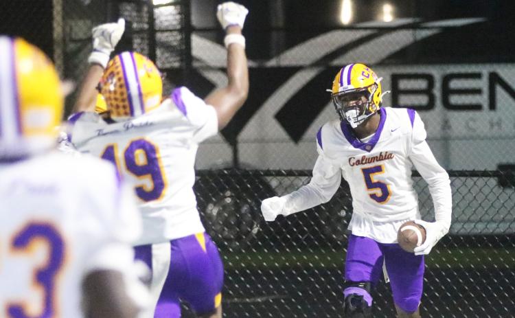 Columbia receiver Legend Camiel (19) runs over to celebrate with receiver Jaylon Willis (5) after Willis a caught touchdown against Manatee on Oct. 2. (JORDAN KROEGER/Lake City Reporter)