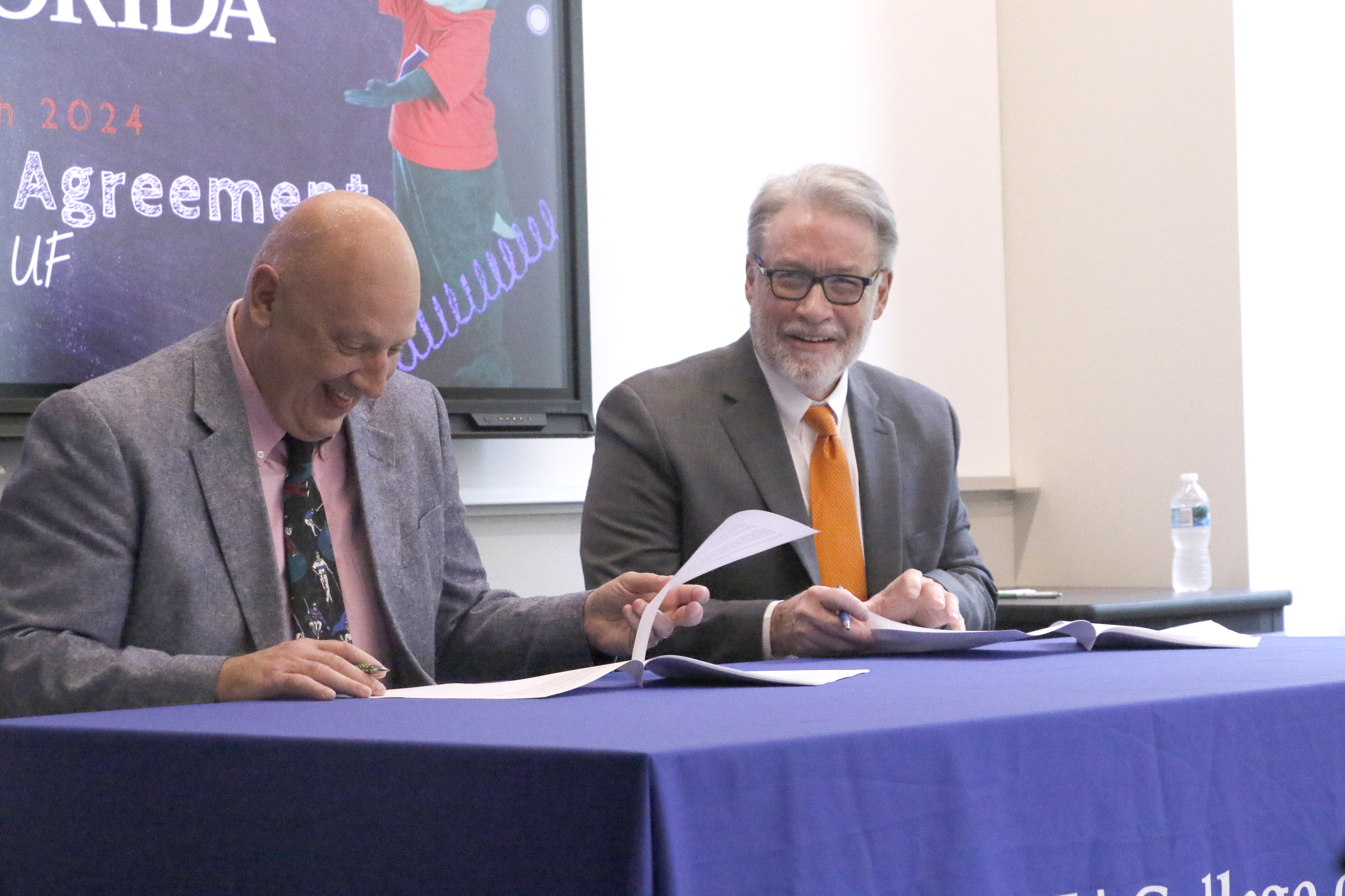 Florida Gateway College President Larry Barrett (left) and David Richardson, the dean of the College of Liberal Arts and Sciences at the University of Florida, signed an articulation agreement Thursday that guarantees FGC graduates with admission into 17 degree programs at UF’s liberal arts college. (MORGAN MCMULLEN/Lake City Reporter)