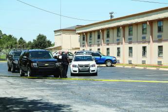 Officers at the scene of a homicide at the Ramada Limited motel on U.S. 90 in 2016. (FILE)