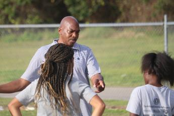 Columbia coach Lawrence Davis talks to his athletes during Wednesday’s practice. (JORDAN KROEGER/Lake City Reporter)