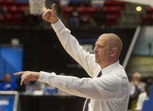 Columbia’s head basketball coach Steve Faulkner instructs his players against Dillard during the Class 6A state semifinals at The RP Funding Center on March 5, in Lakeland. (MICHAEL WILSON/Special to the Reporter)