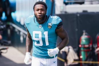 Jacksonville Jaguars defensive end Yannick Ngakoue charges onto the field to face the New Orleans Saints before their game at TIAA Bank Field on Oct. 13, 2019 in Jacksonville. (HARRY AARON/Getty Images/TNS)