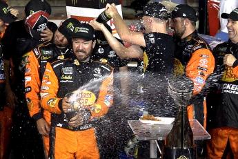 NASCAR driver Martin Truex Jr. celebrates winning the Coca-Cola 600 with his team at Charlotte Motor Speedway on may 26, 2019, in Concord, N.C. (JEFF SINER/Charlotte Observer/TNS)
