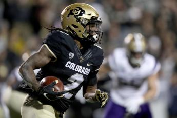 Laviska Shenault Jr. of the Colorado Buffaloes carries the ball against the Washington Huskies in the first quarter at Folsom Field on Nov. 23, 2019 in Boulder, Colorado. (MATTHEW STOCKMAN/Getty Images/TNS)