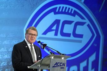 Commissioner John Swofford speaks during the Atlantic Coast Conference NCAA college football media day on  July 17, 2019, in Charlotte, N.C. There are 130 major college football teams, spread across 41 states and competing in 10 conferences, save for a handful of independents. The goal is to have all those teams start the upcoming season at the same time — whether that's around Labor Day as scheduled or later — and play the same number of games. (AP FILE PHOTO)