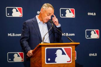 Major League Baseball commissioner Rob Manfred addresses reporters during MLB Media Day activities on Feb. 18, in Scottsdale, Ariz. (SMILEY M. POOL/TNS)