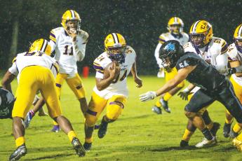 Columbia running back Tony Fulton runs up the field against Ponte Vedra in last year’s regional quarterfinals. (FILE)
