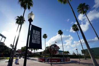 A Black Lives Matter banner hangs outside of the arena after a postponed NBA first round playoff game between the Milwaukee Bucks and the Orlando Magic at AdventHealth Arena at ESPN Wide World Of Sports Complex on Aug. 26, in Lake Buena Vista. (ASHLEY LANDIS/Getty Images/TNS)