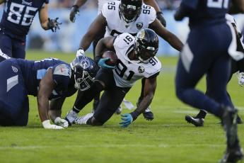 Jacksonville Jaguars defensive end Yannick Ngakoue (91) gets control of a fumble by the Tennessee Titans on Nov. 24, 2019 at Nissan Stadium in Nashville, Tennessee. The Minnesota Vikings sent a 2021 second-round pick and a conditional 2022 fifth-rounder to Jacksonville in a trade for Ngakoue. (SILA WALKER/Getty Images/TNS)