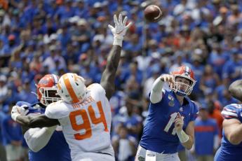 Florida quarterback Kyle Trask throws a pass over Tennessee defensive lineman Matthew Butler last season. (AP FILE PHOTO)