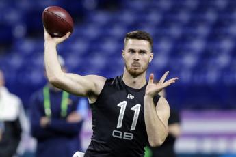 Oregon State quarterback Jake Luton throws a pass at the NFL football scouting combine on Feb. 27, in Indianapolis. The Jacksonville Jaguars are going with another college journeyman and sixth-round draft pick as their backup quarterback. General manager Dave Caldwell and coach Doug Marrone kept rookie Jake Luton to play behind Gardner Minshew as they finalized their 53-man roster on Saturday. They cut veteran Mike Glennon and waived Josh Dobbs. (AP FILE PHOTO)